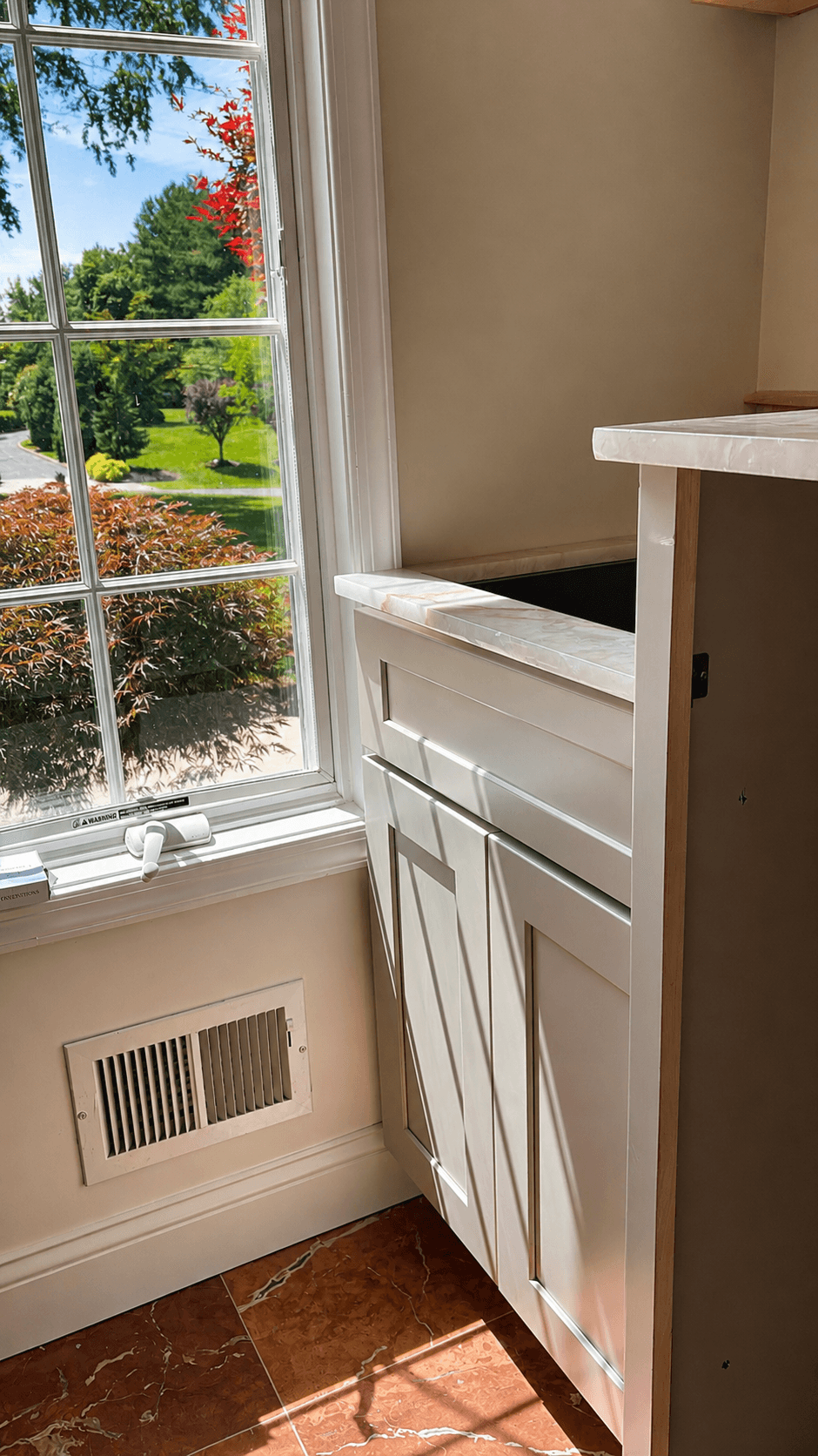 Cristallo Fire laundry room countertop beneath a window