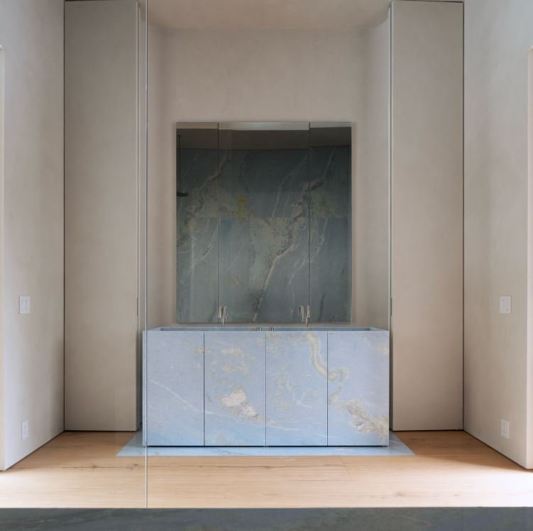 Integral Blue Celeste marble vanity with door cladding and medicine cabinet