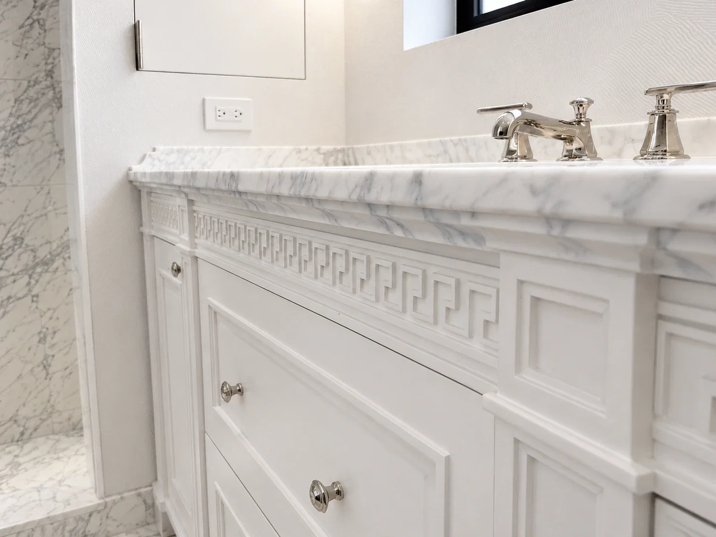 Vanity marble edge detail with carved Greek key apron