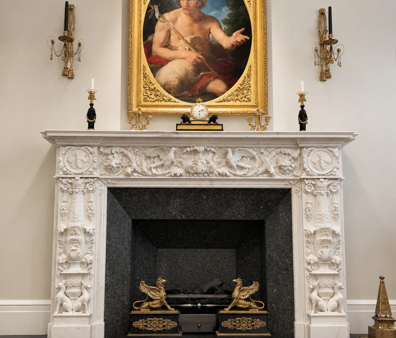 Symmetrical view of the restored marble mantel with honed Belgian Bluestone firebox